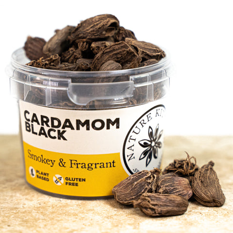 black cardamoms in a pot 