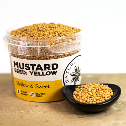 Yellow mustard seeds in a pot